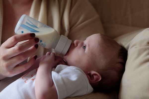 Baby drinking a bottle of milk